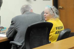 Tina Marie Alcorn, right, talks with attorney John Hayden during Alcorns first appearance on Tuesday in Clallam County Superior Court after extradition from Arkansas in connection with the 2016 homicide of George Cecil David in Port Angeles. (Keith Thorpe/Peninsula Daily News)