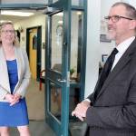 Retiring Port Angeles School District Superintendent Marty Brewer, right, shares a career experience as his replacement, Michelle Olsen, listens during a retirement gathering on Thursday at Lincoln Center in Port Angeles. (Keith Thorpe/Peninsula Daily News)