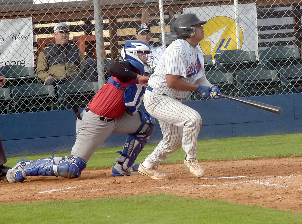 Lefties Dom Dominguez bats as Seattle Gumberoos catcher tries to get past on Thursday in Port Angeles. (Keith Thorpe/Peninsula Daily News)