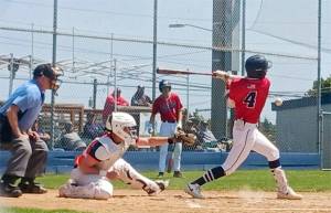 Wilder Seniors Bryant Laboy hits a chopper against Whatcom Post No. 7 while Landen Olson waits in the on-deck circle. Wilder Senior was able to win the pitchers duel with a walk-off hit in the bottom of the seventh by Braydan White. (Pierre LaBossiere/Peninsula Daily News)