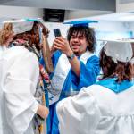 Chimacum High School senior Jesse Daniels takes crazy cell phone photos of his classmates while waiting to march to the gym for his graduation ceremony at Chimacum High on Saturday. (Steve Mullensky/for Peninsula Daily News)
