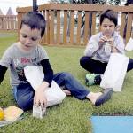 Eragon Terry, 7, left, and his brother, Raphael Terry, 11, both of Port Angeles, sort the contents of free lunch bags received through the Summer Food Service Program on Wednesday at the Dream Playground at Erickson Playfield in Port Angeles. The program, administered by the Boys & Girls Clubs of the Olympic Peninsula, provides free meals to all youngsters younger than 18 Monday through Friday at 11 locations in Port Angeles and Sequim. About 250 meals per day are available at the Dream Playground, the Boys & Girls Clubs Turner Unit, Jefferson Elementary School, Shane Park and Evergreen Family Village in Port Angeles, as well as the Boys & Girls Clubs Carroll C. Kendall Unit, Greywolf Elementary School, Carrie Blake Park, Elk Creek Apartments, Mountain View Court Apartments and SeaBreeze Apartments in Sequim. (Keith Thorpe/Peninsula Daily News)