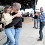 Lorna Kay Smith and Philip Wade, both of Sequim, dance to the music of Roses Pawn Shop to kick off the Concert on the Pier music series on Wednesday evening at Port Angeles City Pier. The series, presented by the Juan de Fuca Foundation and sponsored by Strait View Credit Union, D.A. Davidson & Co., 102.1 FM The Strait and Peninsula Daily News, continues at 6 p.m. Wednesday with the Wild Rumors band. (Keith Thorpe/Peninsula Daily News)