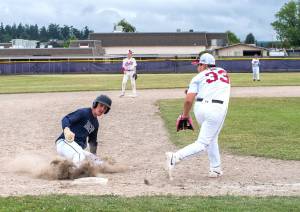 Wilder Junior's Hunter Tennell slides into third base against the WBS Colts in Sequim on Friday. (Emily Mathiessen/Olympic Peninsula News Group)