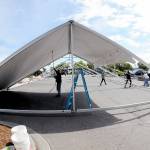 A crew erects an activity tent on Thursday in the parking lot of Port Angeles City Pier in preparation for todays Independence Day events. For a list of July 4 activities, see cmg-northwest2.go-vip.net/peninsuladailynews/entertainment/fourth-of-july-events-set-on-peninsula/. (KEITH THORPE/PENINSULA DAILY NEWS)