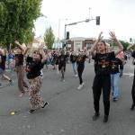 Cast members from the Ghostlight Productions' presentation of "The Lion King Jr." march in Friday's July 4 parade in Port Angeles. (Keith Thorpe/Peninsula Daily News)