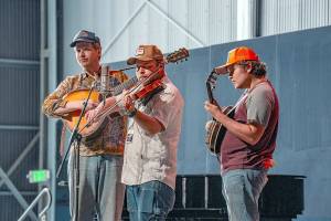The Tennessee Hillbuddies, from left, Conner Vlietstra, Henry Barnes and Trevor Holder, perform during a concert at McCurdy Pavilion at Fort Worden State Park on Friday. (Steve Mullensky/for Peninsula Daily News)
