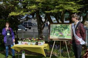 Suzan Mannisto, co-manager of Pioneer Memorial Park, introduces the Pathway Accessible to All Project as Sequim Irrigation Festival Prince Malachi Byrne looks on. (Sequim Prairie Garden Club)