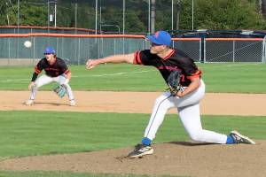 Dave Logan/for Peninsula Daily News
Port Angeles starting pitcher Liam Karlson delivers a pitch during Wednesday night's contest with the Victoria HarbourCats at Civic Field.