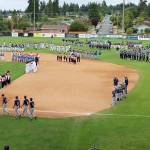Dave Logan/for Peninsula Daily News Teams line up on the Civic Stadium diamond for the Northwest Washington Cal Ripken State Championships opening ceremony Wednesday evening. Port Angeles is hosting the championships for the first time in 20 years. Organizers expect the event to draw between 1,500 and 2,000 visitors, including families, coaches and officials. dlogan
