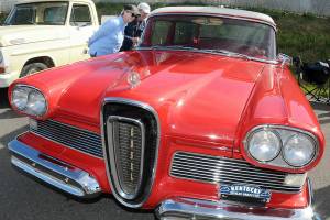 Kelly and Dan Freeman of Port Ludlow examine a 1958 Edsel on display during Friday evenings 29th annual Ruddell Cruise-In at Ruddell Auto in Port Angeles. The event featured hundreds of antique and vintage automobiles from across the region as well as food, music and other activities. (Keith Thorpe/Peninsula Daily News)