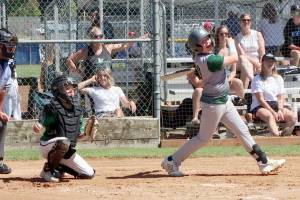 Port Angeles U11’s Mason Henderson hits a RBI to right field as the local team played the Lynden Lobos in the championship game, falling 9-5. (Dave Logan/for Peninsula Daily News)