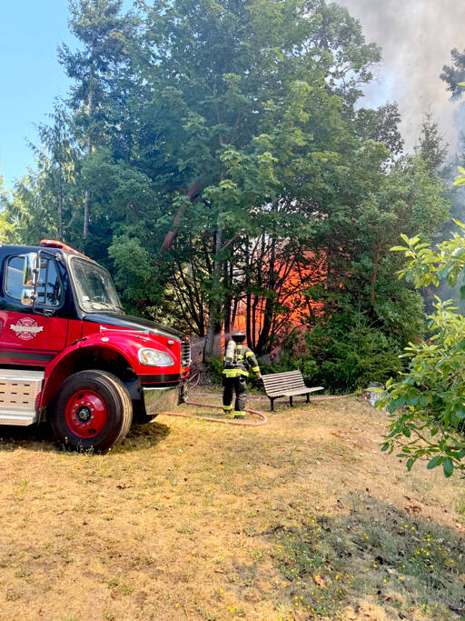 Firefighters work to contain a wildland fire on Tuesday afternoon near Brinnon. Go now evacuation orders were given from Jefferson Countys Emergency Operations Center. (Jefferson County Sheriffs Office)