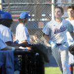 KEITH THORPE/PENINSULA DAILY NEWS Lefties outfielder Garrett Cooper, second from right, is greeted by his teammates after rounding the bases on a home run against the Redmond Dudes on Thursday evening at Port Angeles Civic Field.