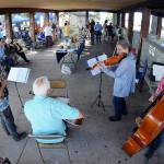 Members of the musical group Soupbones, from left, Ed Schmid of Port Angeles, Ron Munro of Sequim, Carly List of Port Angeles and Hugh Starks of Sequim, perform at a Good Trouble community gathering and picnic on Thursday at Erickson Playfield in Port Angeles. Organizers of the event, one of numerous gatherings across the United States, decided to forego conventional politics while commemorating the life of civil rights activist John Lewis. (Keith Thorpe/Peninsula Daily News)