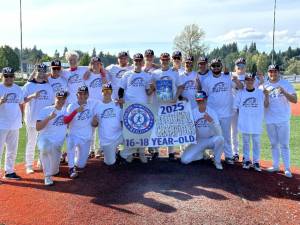 The Wilder Senior Baseball Club celebrates winning the Pacific Northwest Babe Ruth 16-18 tournament in Kelso on Sunday. The senior qualified to play in the Babe Ruth World Series in Florida. (Courtesy of Zac Moore)