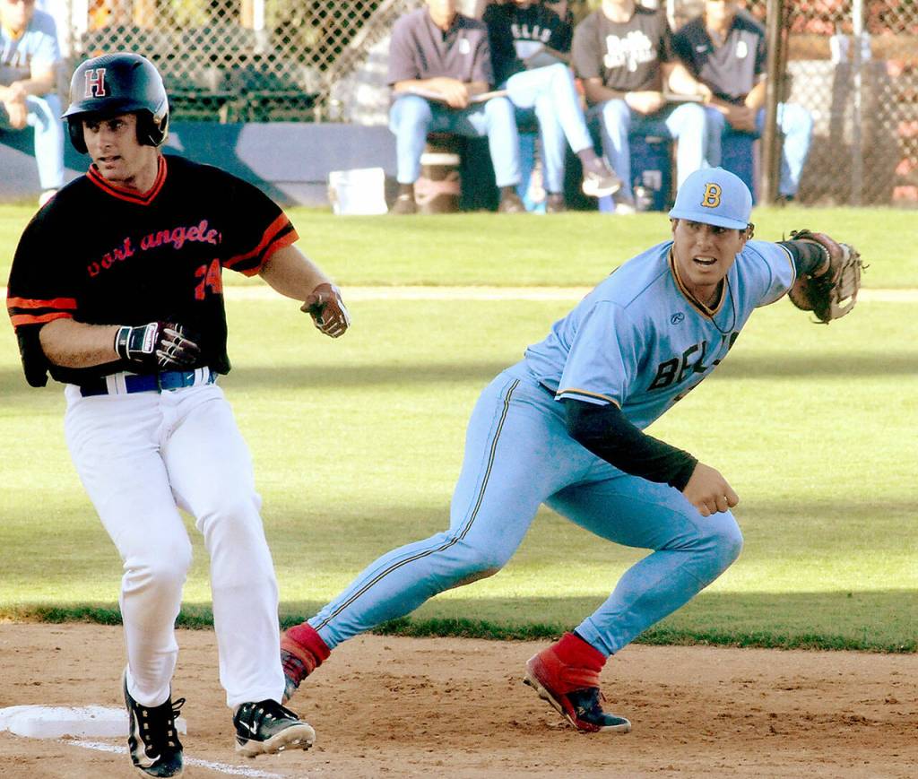 Lefties baserunner Tyler Shulman, left, and Bellingham first baseman Nico Azpilcueta look for the umpires call after Shulman barely beat the tag for a hit on Wednesday night at Port Angeles Civic Field. (Keith Thorpe/Peninsula Daily News)