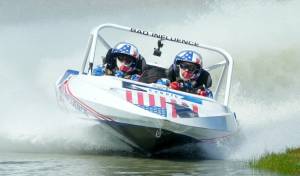 The Bad Influence Boat No. 156 out of Oregon driven by Steve Church and navigated by Randi Church competes in the 400 class at the American Sprint Boat Racing races at the Extreme Sports Park on Saturday west of Port Angeles. Dozens of racers from all around the Pacific Northwest and several from New Zealand competed all weekend at the ESP in the first of two events coming to the Olympic Peninsula. Look in Tuesdays sports sections for racing results. (Jeff Halstead/for Peninsula Daily News)