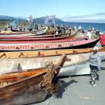 Tribal canoes from around the region sit on the beach on Thursday after arriving at Lower Elwha Klallam territory. (Keith Thorpe/Peninsula Daily News)