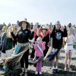 Greeters sing a welcome song to an arriving canoe on Thursday at Lower Elwha. (Keith Thorpe/Peninsula Daily News)