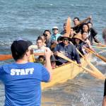 The Puyallup Canoe Family rows ashore on Thursday at Lower Elwha Klallam territory. (Keith Thorpe/Peninsula Daily News)