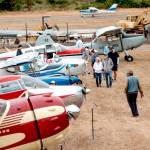 Spectators roam the grounds of Jefferson County International Airport looking over some of the historic airplanes on display during the second annual Jefferson County Airport Day on Saturday. (Steve Mullensky/for Peninsula Daily News)