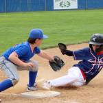 Carson Stovall of the Port Angeles 11U baseball team slides safely into third base, beating the tag of Dax Higgins of the Kingston Kings this weekend at Lincoln Park. The Port Angeles team went on to win its opening game of the Dick Brown Memorial Tournament 15-6. Thirteen teams from ages 8 to 11 competed in the two-day tournament. (Dave Logan/For Peninsula Daily News)