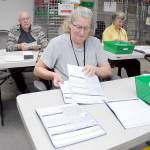 Clallam County election workers Shellie Andrews of Port Angeles, front, Ray Farrell of Forks, left, and Kathy Schreiner of Sequim organize ballots on Tuesday at the Clallam County Courthouse. Primary election results from Tuesday night are at cmg-northwest2.go-vip.net/peninsuladailynews, and coverage of the election will be in Thursdays print edition. (Keith Thorpe/Peninsula Daily News)