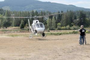 A surveillance and patrol helicopter operated by the U.S. Department of Homeland Security lands at Saturdays Unity of Effort festival of military, law enforcement and first responders in Sequim. The event, hosted by Security Services Northwest, featured a variety of military equipment, law enforcement and public safety displays, food, music and other activities as well as a helicopter fly-in. (Keith Thorpe/Peninsula Daily News)