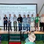 The 7th annual Port Angeles Hall of Fame induction ceremony was held Saturday night on the grass at Civic Field. More than 350 people attended the event held under a tent. Nine individuals were inducted as well as three teams  the 1977 girls basketball, 1972 football, and 1952 boys basketball teams. The nine individuals were Bob Blackburn, track; Mike Chamberlin, swimming; Gus Kravas, basketball; Steve Johansen, basketball; Jodie Jones, softball; Bob Lovell, football; Adam Macomber, football; Bob Spencer, swimming; and Susan Wilson Childers, badminton. Here, Jerry Payne, far left, speaks for the 1972 football team that was ranked as high as fifth in the state and had seven shutouts in 10 games. (Photos by Dave Logan/for Peninsula Daily News)