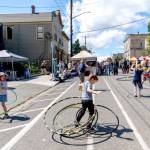 Quinn Early, 6, of Port Townsend, spins five hula hoops at once during the 33rd Uptown Port Townsend Street Fair on Saturday. (Steve Mullensky/for Peninsula Daily News)
