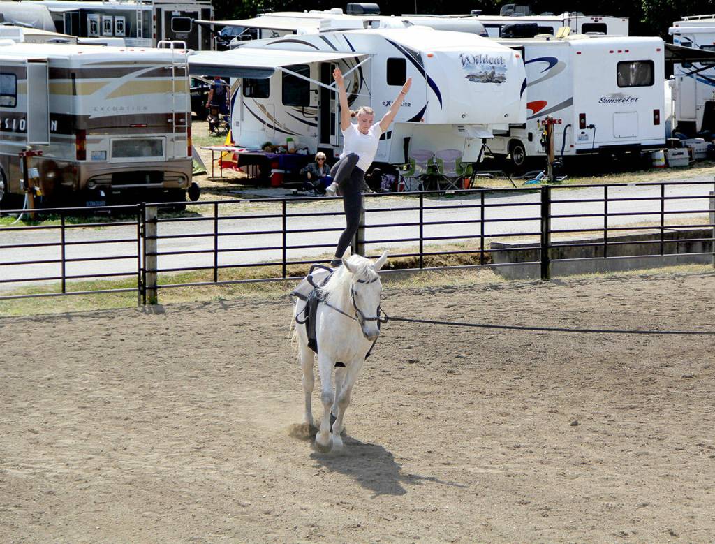 Photo by Karen Griffiths
Gig Harbor based Harbor View Vaulters gave a stellar performance at the Jeffco Fair on Aug. 9. Advanced member Genna Downen showcased a series of vaulting moves on the smooth, slow cantering horse Baron Van Hugo
Harbor View Vaulters Four Winds Riding Center in Gig Harbor