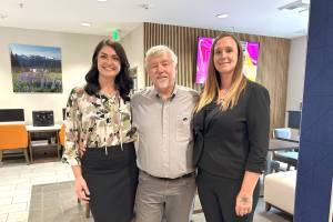Matthew Nash/Olympic Peninsula News Group
Leaders with Holiday Inn Express & Suites, from left, Namaste Stayton, vice president of hotel operations, Bret Wirta, owner, and Shelby Schleve, general manager, stand in The Great Room of the Sequim hotel. It was part of a massive $4 million remodeling project that opened up this space, refreshed hotel rooms and suites and added new amenities throughout the building.