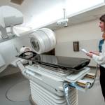 Dr. Sabrina Prime, a radiation oncologist at Jefferson Healthcare, demonstrates the new $2.5 million linear accelerator that will be used in the treatment of cancer patients during a dedication and open house on Sunday in Port Townsend. (Steve Mullensky/for Peninsula Daily News)