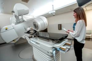 Dr. Sabrina Prime, a radiation oncologist at Jefferson Healthcare, demonstrates the new $2.5 million linear accelerator that will be used in the treatment of cancer patients during a dedication and open house on Sunday in Port Townsend. (Steve Mullensky/for Peninsula Daily News)