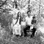 New Port Angeles High School assistant principal and athletic director Jarom Packer is pictured with his wife Merrin and three children.