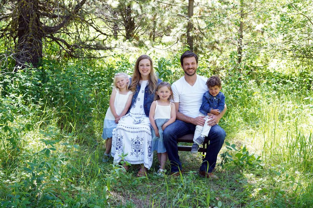 New Port Angeles High School assistant principal and athletic director Jarom Packer is pictured with his wife Merrin and their three children.