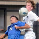 KEITH THORPE/PENINSULA DAILY NEWS
Rogue's Andre Estanoqui, left, and Peninsula's Max Pieper battle for control on Friday afternoon in Port Angeles.