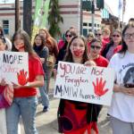 Participants in Mondays missing and murdered indigenous people (MMIP) march wore red and walked from the Elwha Klallam Heritage Center to the Port Angeles Gateway Transit Center. (Elijah Sussman/Peninsula Daily News)