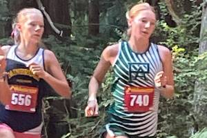 Port Angeles Cross Country
Port Angeles senior Leia Larson runs along a forested stretch during the Olympic League Cross Country Jamboree at Kitsap County Fairgrounds on Wednesday.
