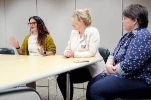 Schelle Fitzpatrick, left, explains her experience in Olympic Medical Centers nursing residency program as the hospitals Chief Nursing Officer Vickie Swanson and Director of Education and Organizational Professional Development look on. Since 2017, 132 nurse graduates have gone through the program, which provides clinical experience, mentoring and support. (Keith Thorpe/Peninsula Daily News)