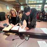 Jon Hamilton, right, is sworn in as a Port Angeles City Council member Tuesday evening in council chambers at Port Angeles City Hall. His first meeting as a council member will be Sept. 16. (City of Port Angeles)