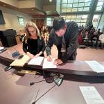 Jon Hamilton, right, is sworn in as a Port Angeles City Council member Tuesday evening in council chambers at Port Angeles City Hall. His first meeting as a council member will be Sept. 16. (City of Port Angeles)