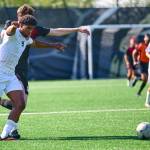 Jay Cline/Peninsula College Athletics
Peninsula College's Jeremy Obah is held at the shoulder and stepped on by Skagit Valley's Robbie Spain during the Pirates' 7-0 win over the Cardinals on Wednesday at Wally Sigmar Field in Port Angeles.