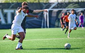 Jay Cline/Peninsula College Athletics
Peninsula College's Jeremy Obah is held at the shoulder and stepped on by Skagit Valley's Robbie Spain during the Pirates' 7-0 win over the Cardinals on Wednesday at Wally Sigmar Field in Port Angeles.