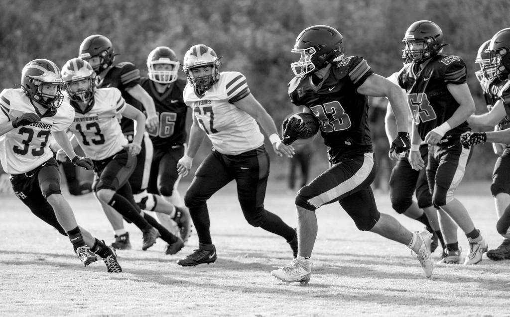 Steve Mullensky/for Peninsula Daily News

Rivals' Luke O'Hara runs a gauntlet of Wolverine defenders during a Friday night non-league game played against Friday Harbor in Port Townsend's Memorial Field.