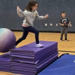Vera Eksteen masters an obstacle course at the Sequim Boys & Girls Club while Hunter Brown, left, and Rome Martin look on. (Boys & Girls Clubs of the Olympic Peninsula)