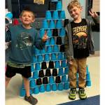 Brandon Layman, left, and Jaxon Dunn celebrate their achievement in the Project L.A.N.E. Stack Attack challenge. (Boys & Girls Clubs of the Olympic Peninsula)