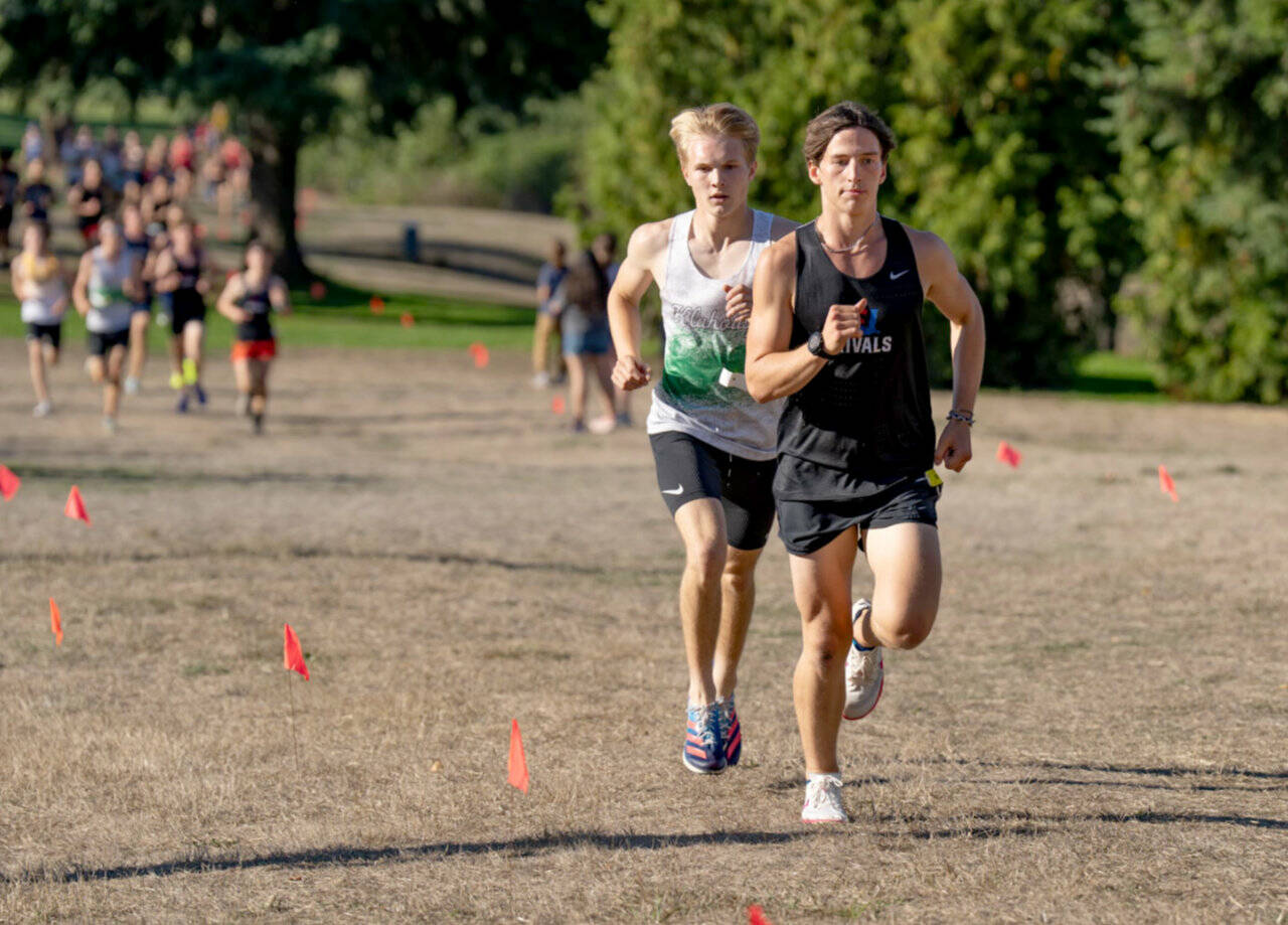 East Jeffersons Joshua Yearian leads Klahowyas Carson Wintch in a Nisqually League meet held at Camas Prairie Park on Tuesday. Yearian won the boys race. (Steve Mullensky/for Peninsula Daily News)