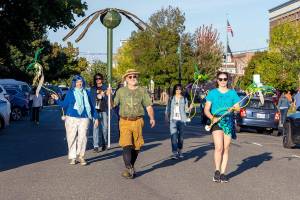 The Bull Kelp Brigade, a community group promoting awareness of ecology of the Salish Sea, marches on Washington Street during the Port Townsend Film Festivals Filmmakers Parade on Friday. (Steve Mullensky/for Peninsula Daily News)